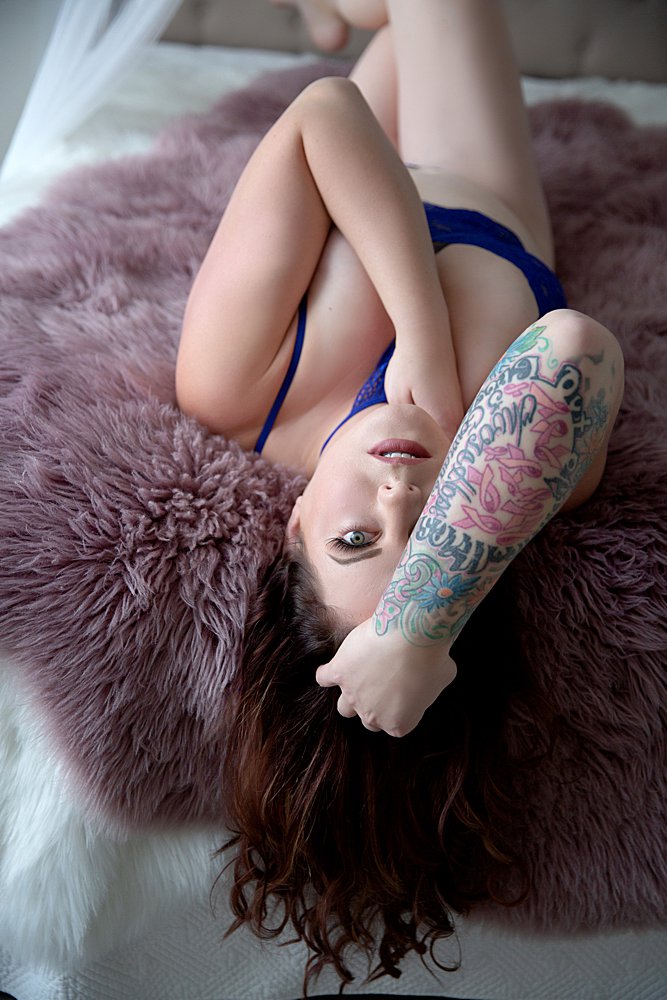 Tattoo sleeve boudoir brunette